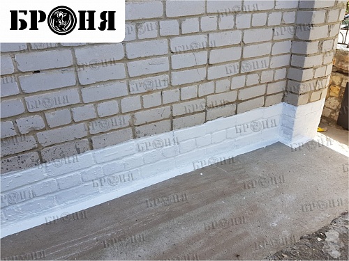 Polymeric waterproofing Bronya AquaBlock on the basement of a residential building in Volgograd (photo)