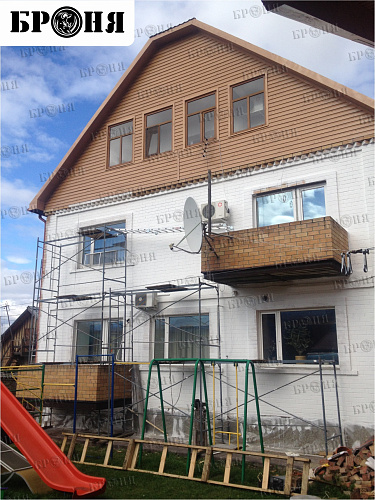 Thermal insulation Bronya and Gydrophobizator Bronya on the facade of a cottage in Khanty-Mansiysk (photo)