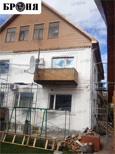 Thermal insulation Bronya and Gydrophobizator Bronya on the facade of a cottage in Khanty-Mansiysk (photo)