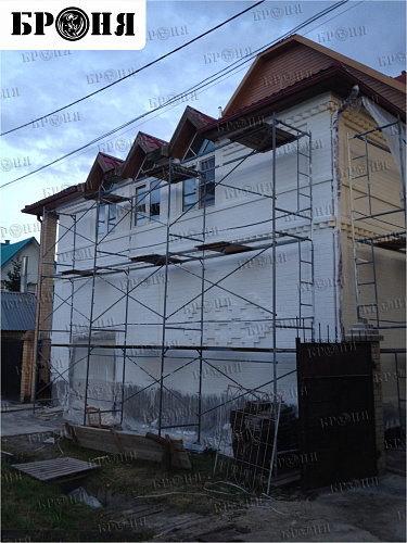 Thermal insulation Bronya and Gydrophobizator Bronya on the facade of a cottage in Khanty-Mansiysk (photo)